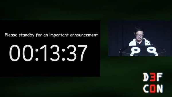 Minh presenting at DEF CON 30 on the Big Rick, a slide with a countdown starting at 00:13:37 can be seen.